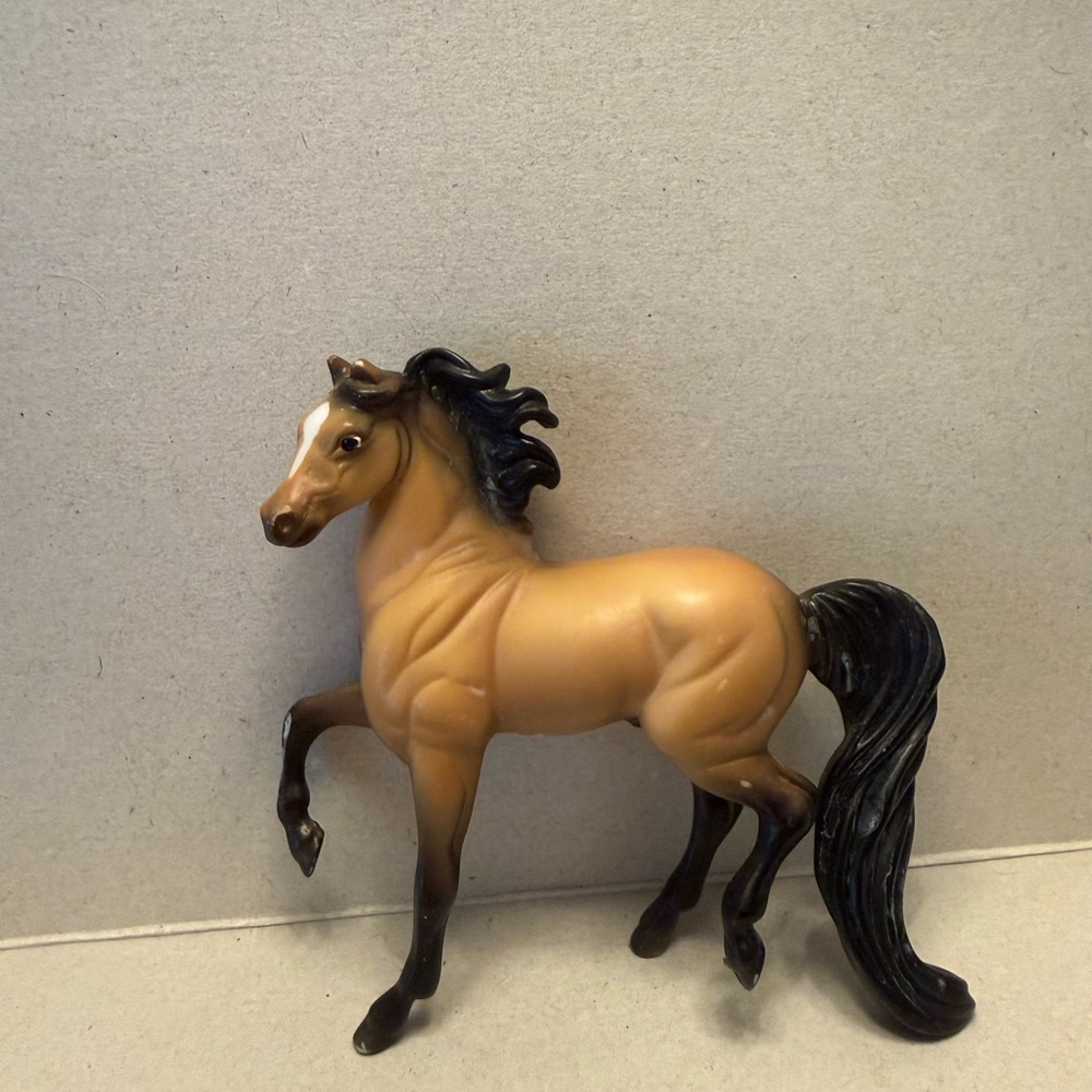 Retired prancing Dun Breyer Model Horse